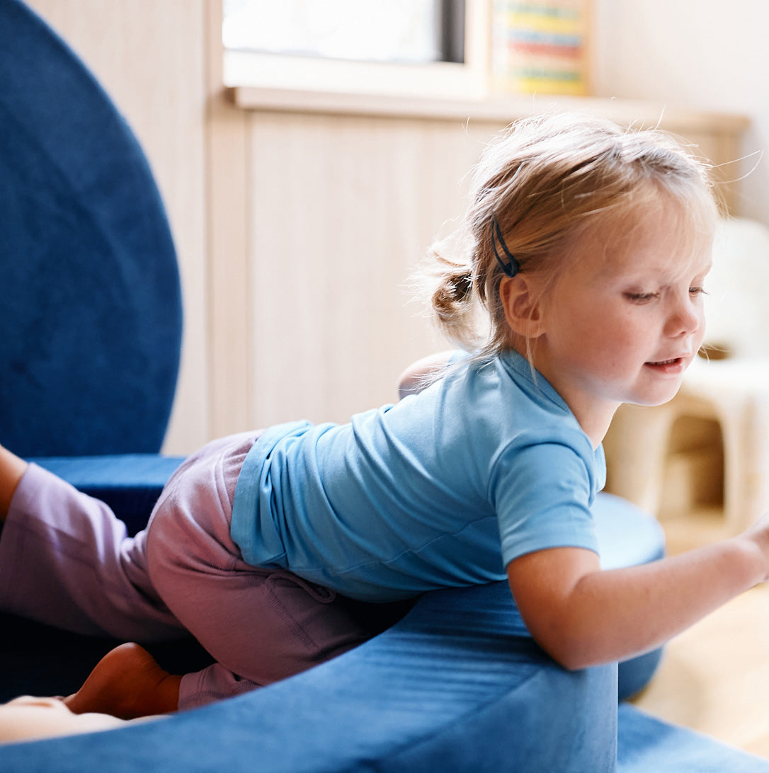 girl wearing farren cornflower blue t shirt playing