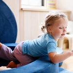 girl wearing farren cornflower blue t shirt playing