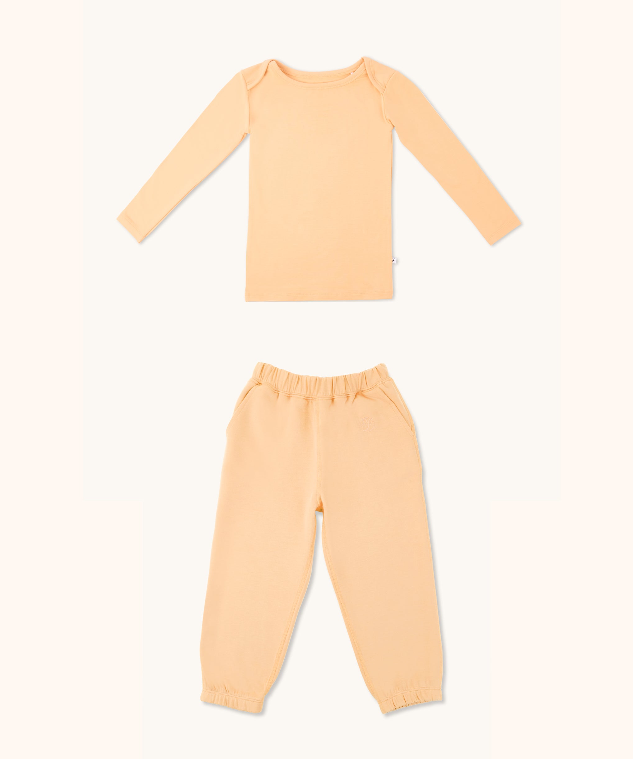 Kids long sleeve t-shirt and joggers set in apricot color.