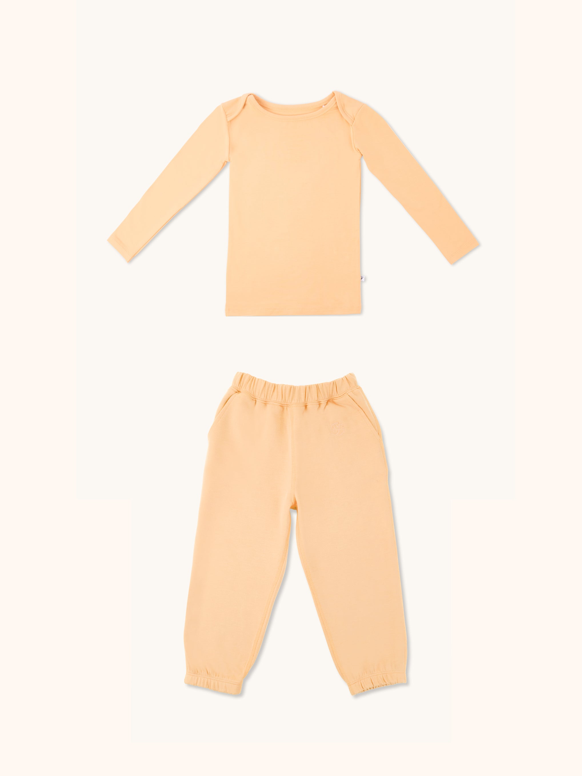 Kids long sleeve t-shirt and joggers set in apricot color.