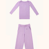 Zoomed-out view of a long sleeve kid's long sleeve t-shirt and straight pant bundle in lilac