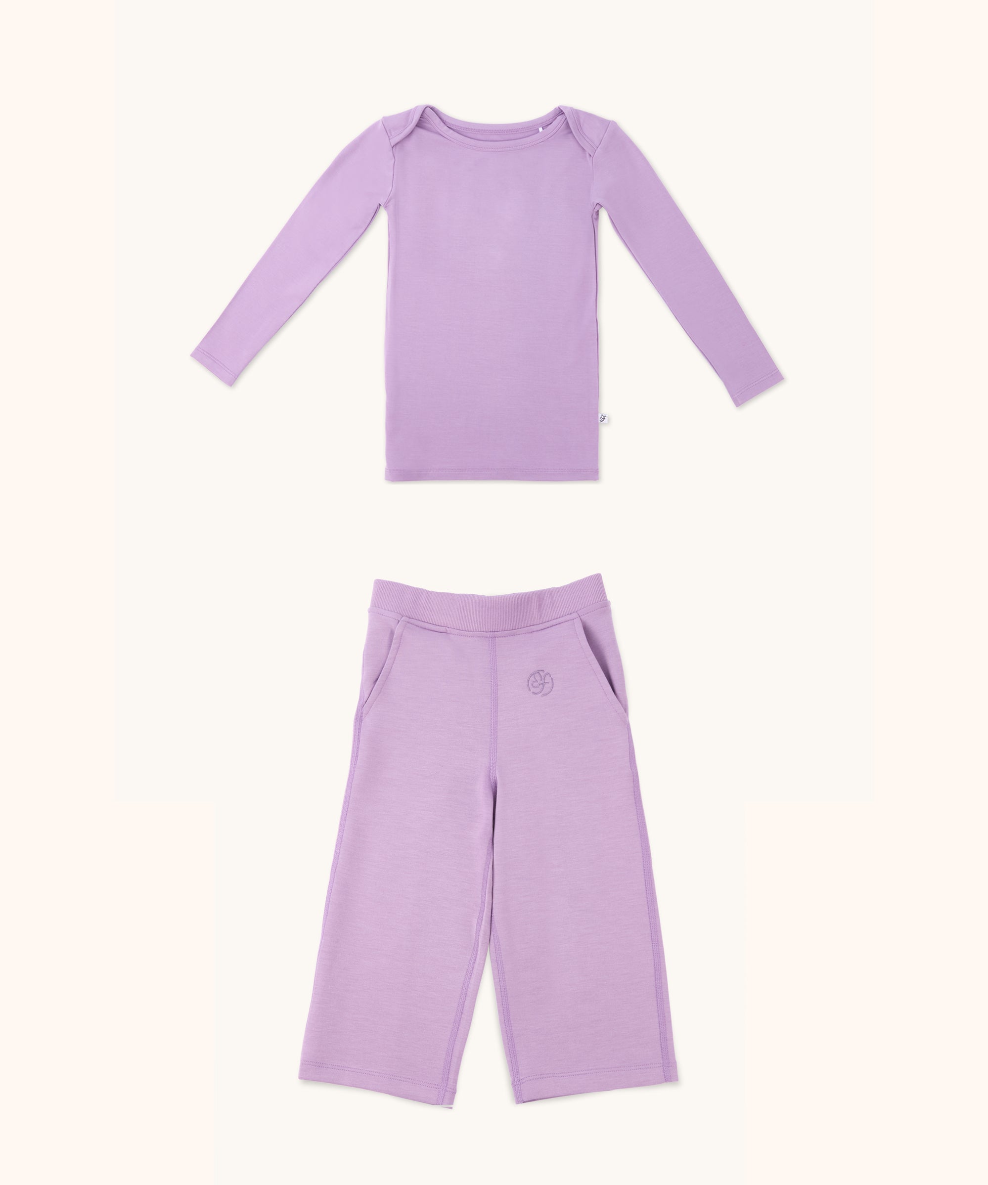 Zoomed-out view of a long sleeve kid's long sleeve t-shirt and straight pant bundle in lilac