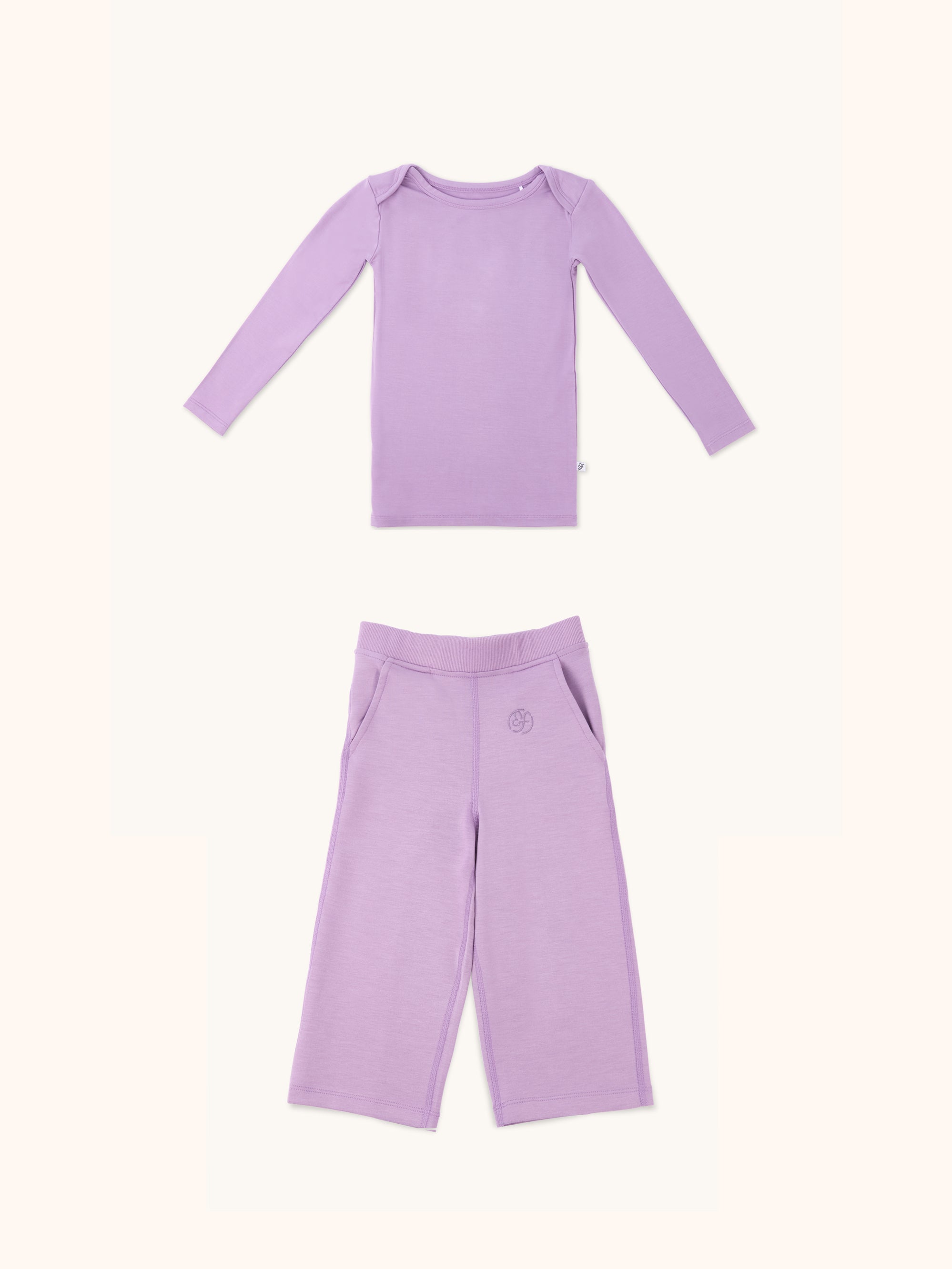 Zoomed-out view of a long sleeve kid's long sleeve t-shirt and straight pant bundle in lilac