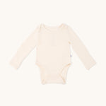 Long sleeve onesie in sand yellow 
color