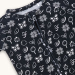 farren nido onseie zipper sleeper black closeup of white details of butterfly flowers and snails