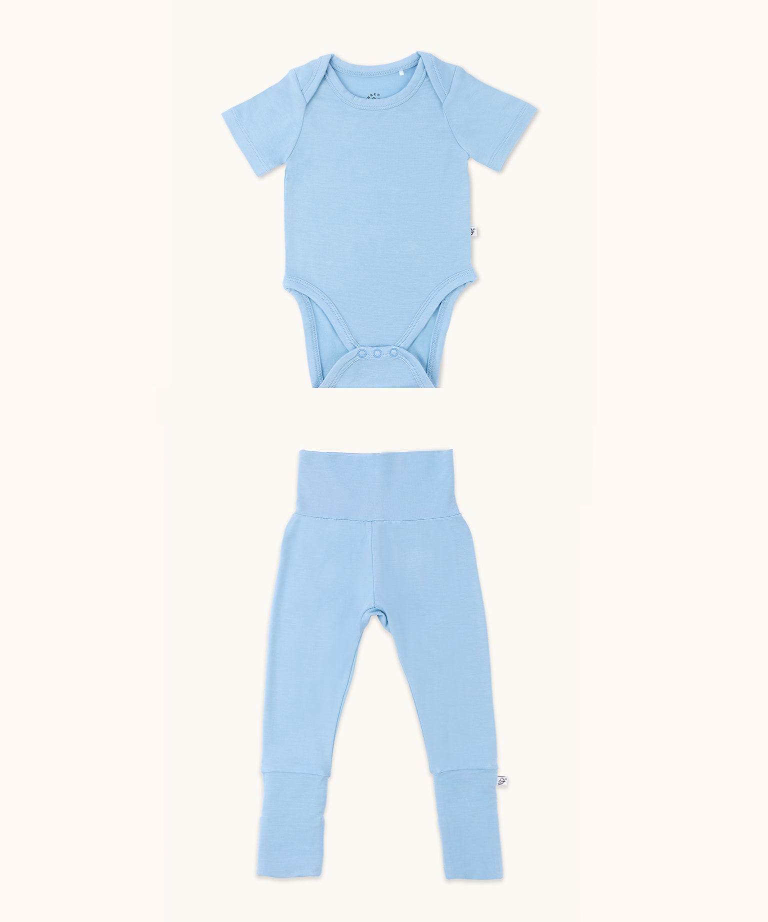 Zoomed-out view of a baby onesie and leggings bundle in glacier blue color.