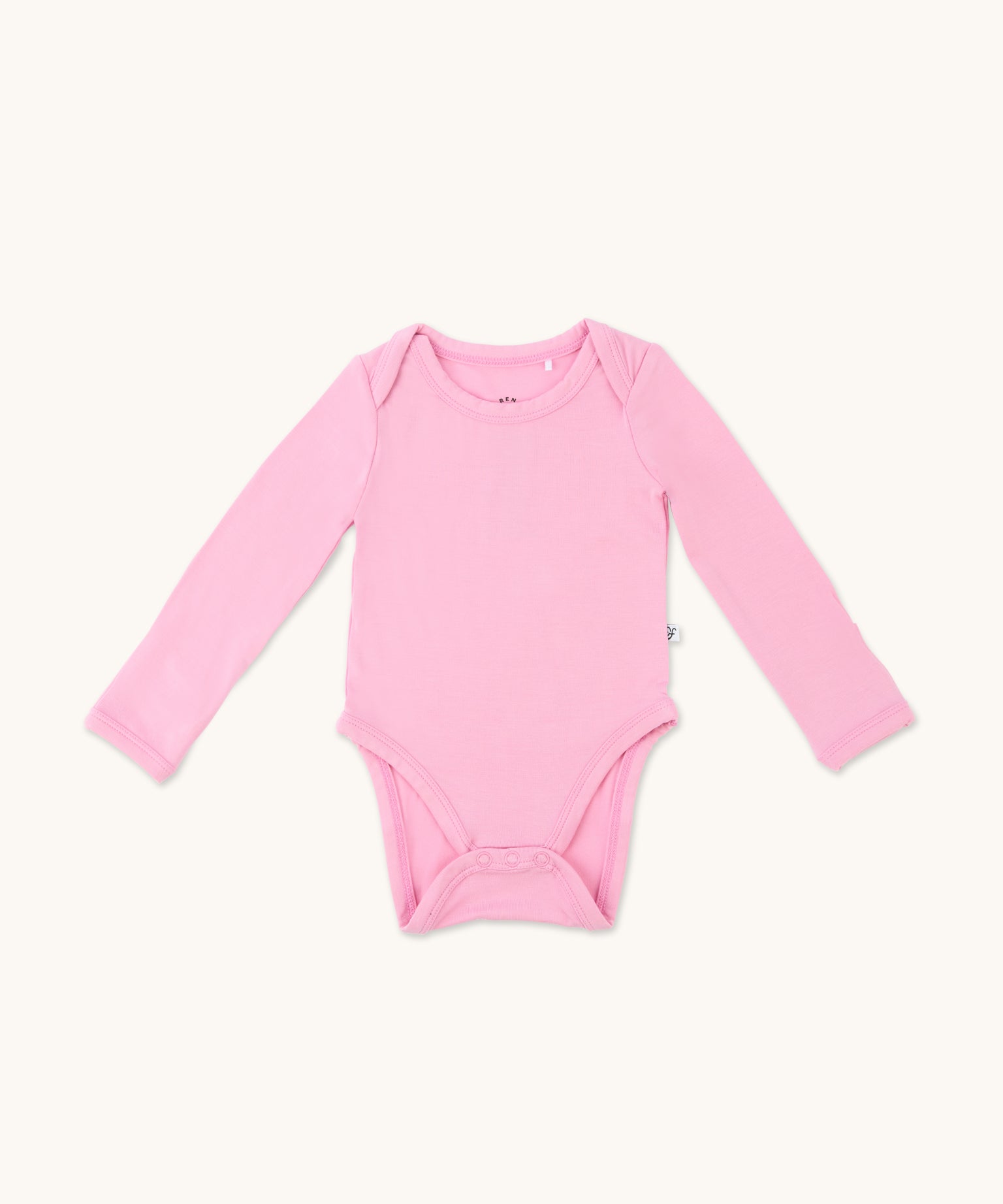 Zoomed-out view of a long sleeve onesie in lotus pink color