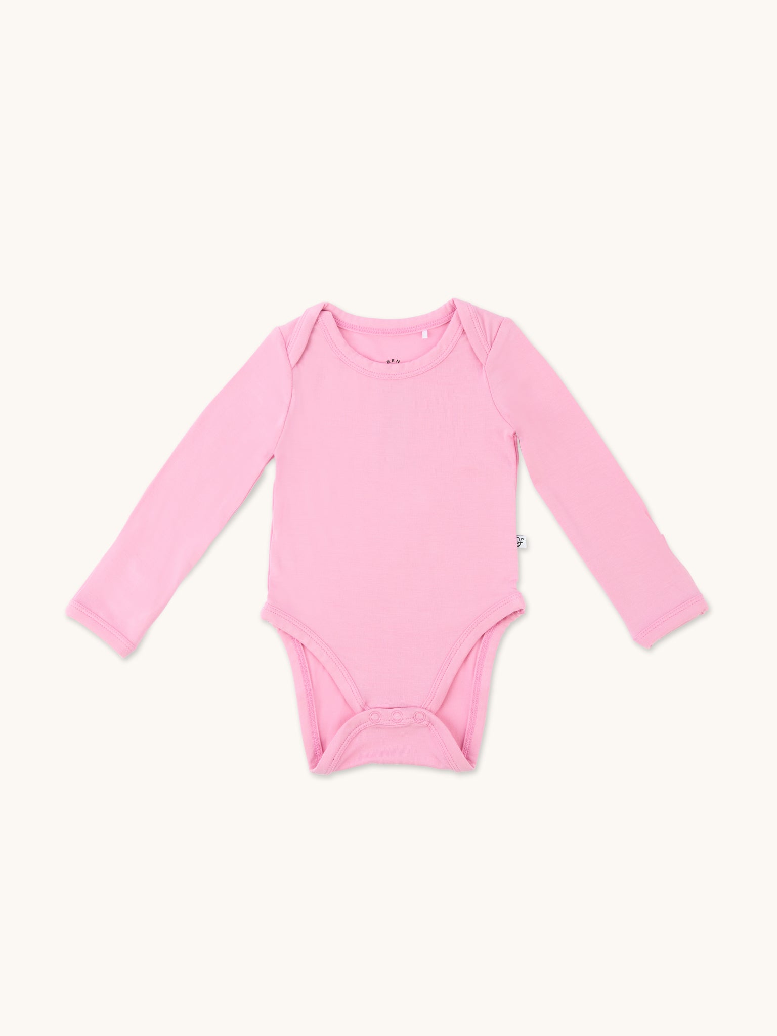 Zoomed-out view of a long sleeve onesie in lotus pink color