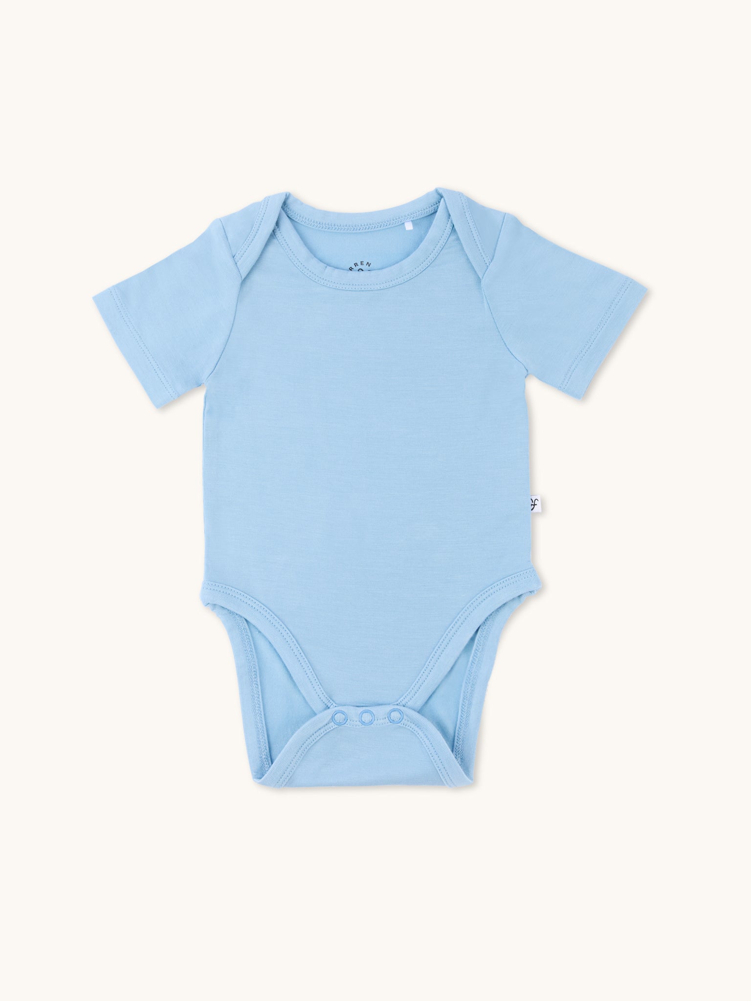 Zoomed-out view of a short sleeve onesie in glacier color