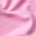 Zoomed-in view of the material of a long sleeve onesie in lotus pink color.